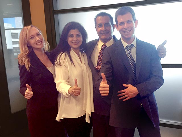 Dr Michael Bahrami with his wife and legal team from Markus Moss PLLC