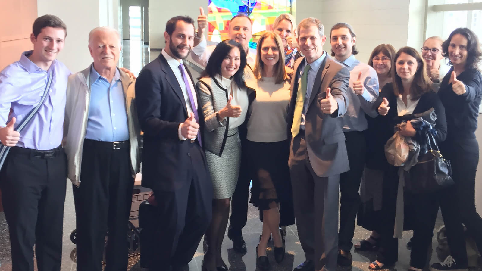 The firm and clients celebrate after another successful verdict.