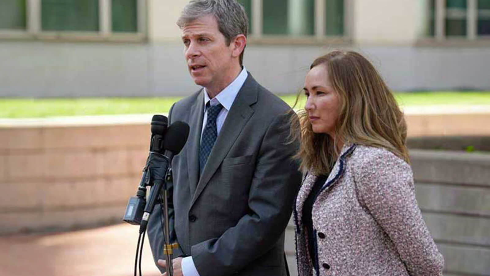 Markus and Moss Speak to the Press after a Verdict.